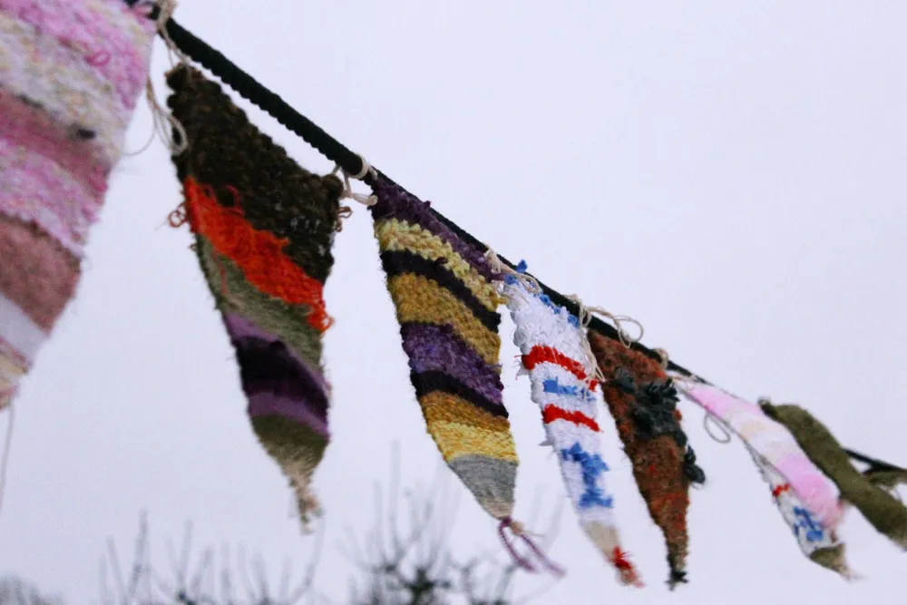 Weave pennants in our drop-in workshop.