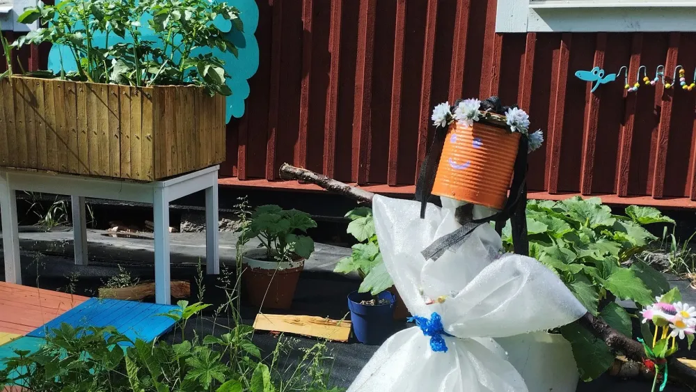 Cute scarecrow guarding the plants at sensory and play garden Axmar Yara