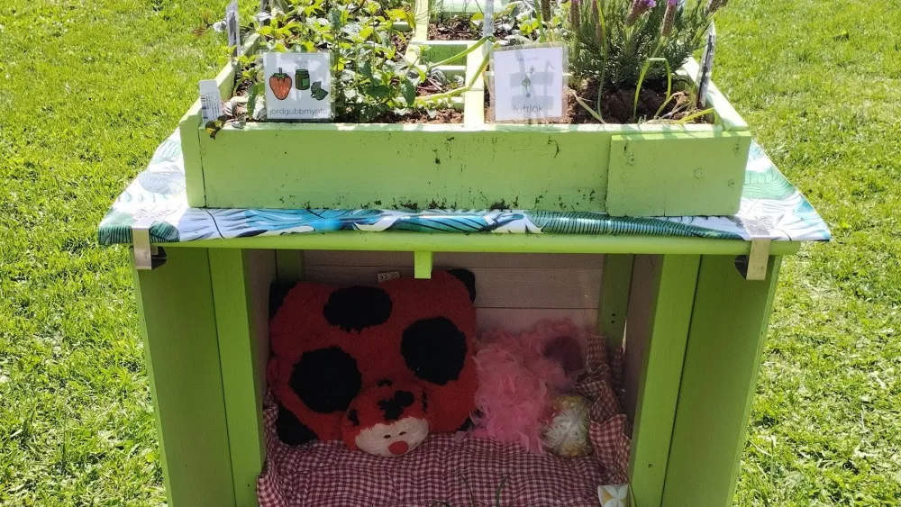 Small den under a herb table at sensory and play garden Axmar Yara