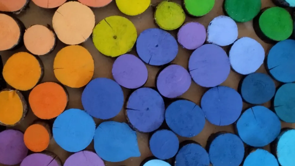 Colourful bits of tree at sensory and play garden Axmar Yara